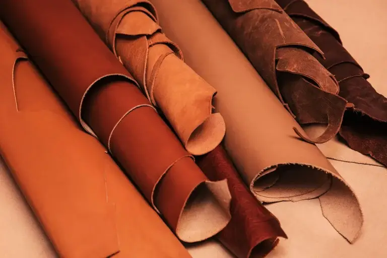 Various rolls of high-quality Moroccan leather hides in different colors from the Sicontact tannery in Fes